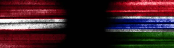 Lotyšsko Gambijské Vlajky Černém Pozadí — Stock fotografie