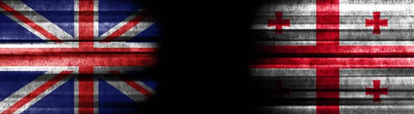 Bandeiras Reino Unido Geórgia Sobre Fundo Preto — Fotografia de Stock