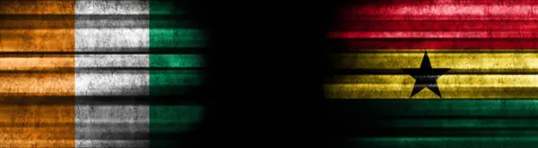 Flaggen Der Elfenbeinküste Und Ghana Auf Schwarzem Hintergrund — Stockfoto