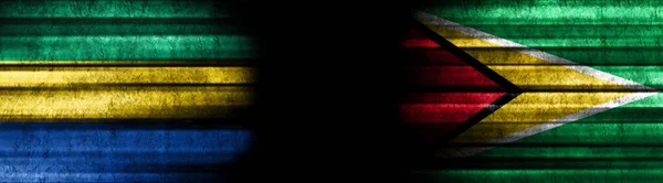 Gabun Und Guyana Flaggen Auf Schwarzem Hintergrund — Stockfoto