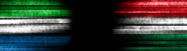 Sierra Leone and Hungary Flags on Black Background