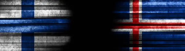 フィンランドとアイスランドの黒い背景の旗 — ストック写真