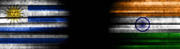 Uruguay and India Flags on Black Background