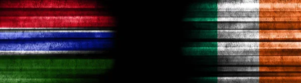 Gambia and Ireland Flags on Black Background