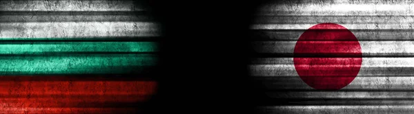 Bulgaria and Japan Flags on Black Background