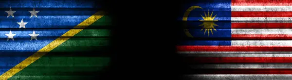Solomon Islands and Malaysia Flags on Black Background