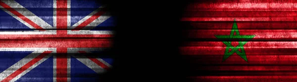 United Kingdom and Morocco Flags on Black Background