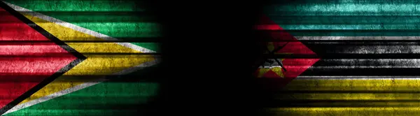 Guyana Mozambique Flags Black Background — Stock Photo, Image