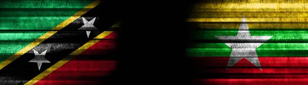 Kitts Und Nevis Und Myanmar Flaggen Auf Schwarzem Hintergrund — Stockfoto