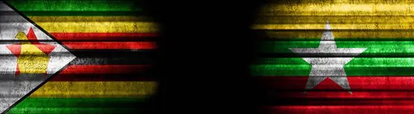 Simbabwe Und Myanmar Fahnen Auf Schwarzem Hintergrund — Stockfoto