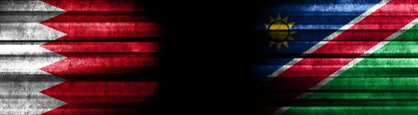 黒い背景のバーレーンとナミビアの旗 — ストック写真