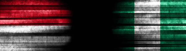 印度尼西亚和尼日利亚黑色背景旗 — 图库照片
