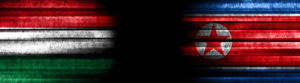 Σημαίες Ουγγαρίας Και Βόρειας Κορέας Μαύρο Φόντο — Φωτογραφία Αρχείου