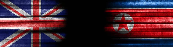 Verenigd Koninkrijk Noord Korea Vlaggen Zwarte Achtergrond — Stockfoto