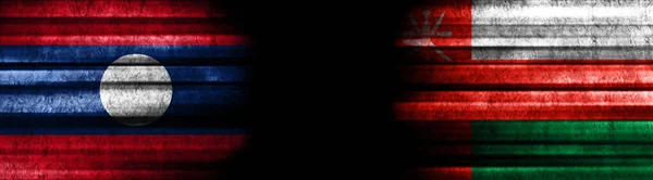 Флаги Лаоса Омана Чёрном Фоне — стоковое фото