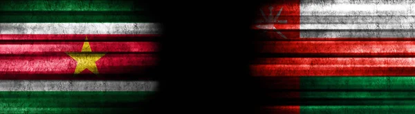 Surinam Oman Flagi Czarnym Tle — Zdjęcie stockowe