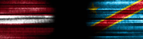 Latvia and Democratic Republic of Congo Flags on Black Background