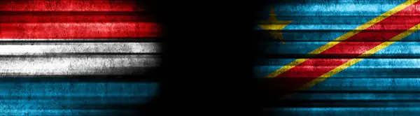 Luxembourg and Democratic Republic of Congo Flags on Black Background