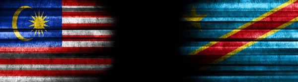Malaysia and Democratic Republic of Congo Flags on Black Background