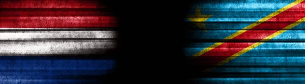 Netherlands and Democratic Republic of Congo Flags on Black Background