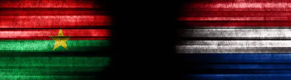 Burkina Faso Och Nederländernas Flaggor Svart Bakgrund — Stockfoto