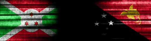 Burundi Papúa Nueva Guinea Banderas Sobre Fondo Negro — Foto de Stock