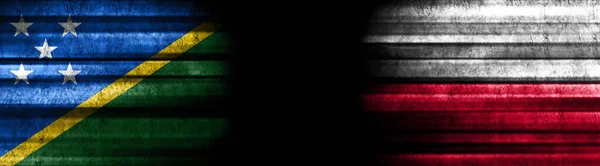 Solomon Islands and Poland Flags on Black Background