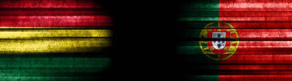 Kara Arkaplanda Bolivya Portekiz Bayrakları — Stok fotoğraf