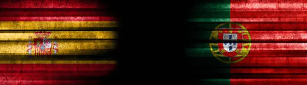 ブラックバックグラウンドのスペインとポルトガルの旗 — ストック写真