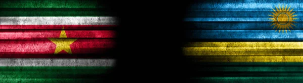 Suriname and Rwanda Flags on Black Background