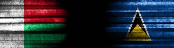 Σημαίες Μαδαγασκάρης Και Αγίας Λουκίας Μαύρο Φόντο — Φωτογραφία Αρχείου