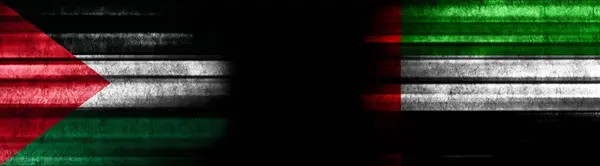 パレスチナとアラブ首長国連邦 黒い背景の旗 — ストック写真
