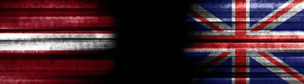 Bandeiras Letónia Reino Unido Sobre Fundo Preto — Fotografia de Stock