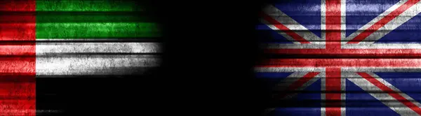 United Arab Emirates and United Kingdom Flags on Black Background