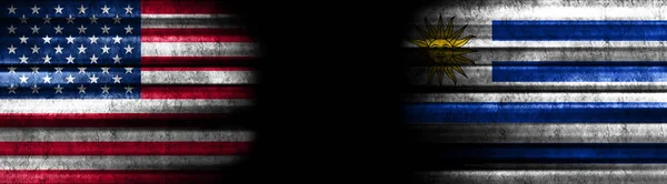 United States and Uruguay Flags on Black Background