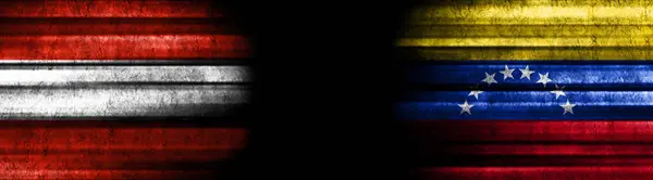 オーストリアとベネズエラの黒い背景の旗 — ストック写真