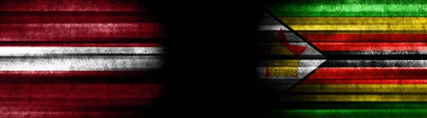Letland Zimbabwe Vlaggen Zwarte Achtergrond — Stockfoto
