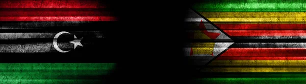 배경에 리비아와 짐바브웨 플래그 — 스톡 사진