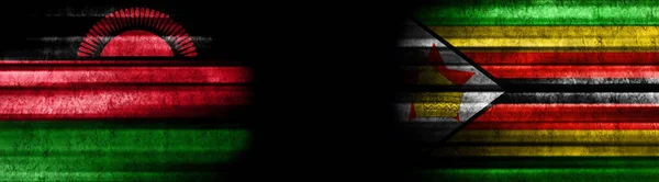 Malawi Und Simbabwe Fahnen Auf Schwarzem Hintergrund — Stockfoto