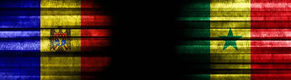 摩尔多瓦和塞内加尔黑色背景旗 — 图库照片
