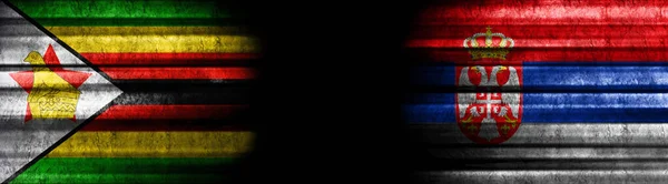 Zimbabwe Serbia Flags Black Background — Stock Photo, Image