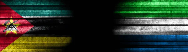 Mozambique Sierra Leone Flags Black Background — Stock Photo, Image