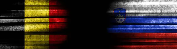 Belgium and Slovenia Flags on Black Background