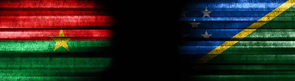 Burkina Faso and Solomon Islands Flags on Black Background