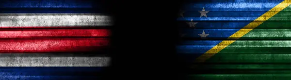 Costa Rica and Solomon Islands Flags on Black Background