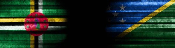Dominica and Solomon Islands Flags on Black Background