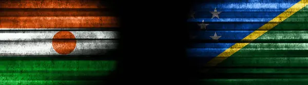 Niger and Solomon Islands Flags on Black Background
