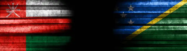 Oman and Solomon Islands Flags on Black Background