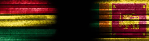 黒い背景にボリビアとスリランカの旗 — ストック写真