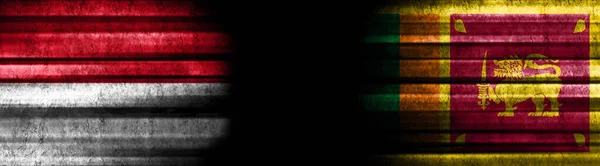 モナコとスリランカの黒い背景の旗 — ストック写真